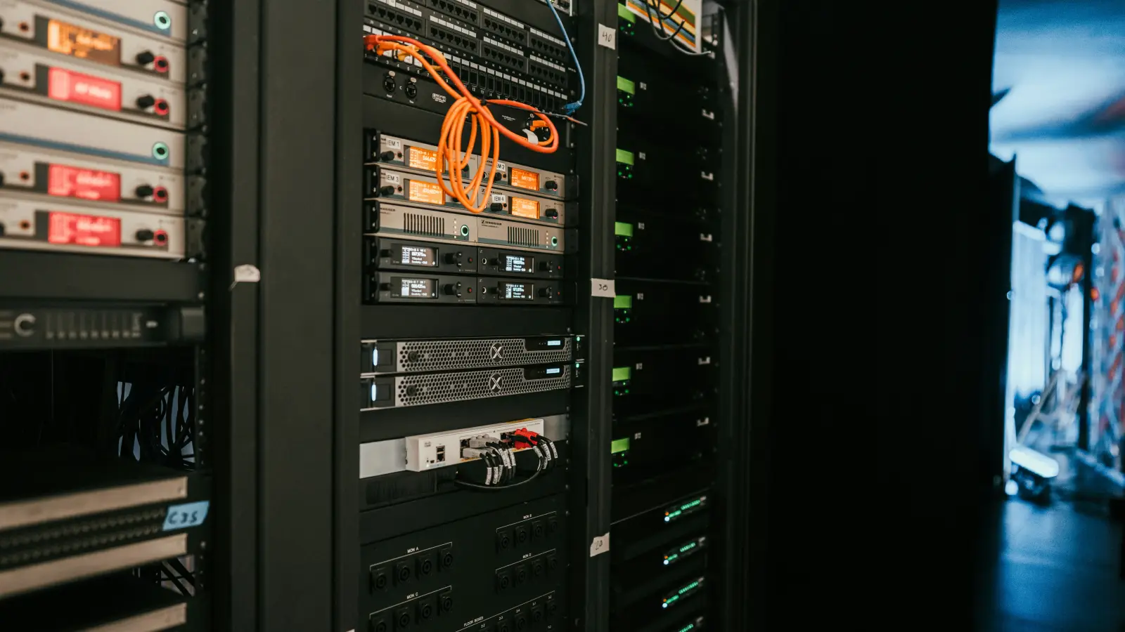 a rack of servers in a server room