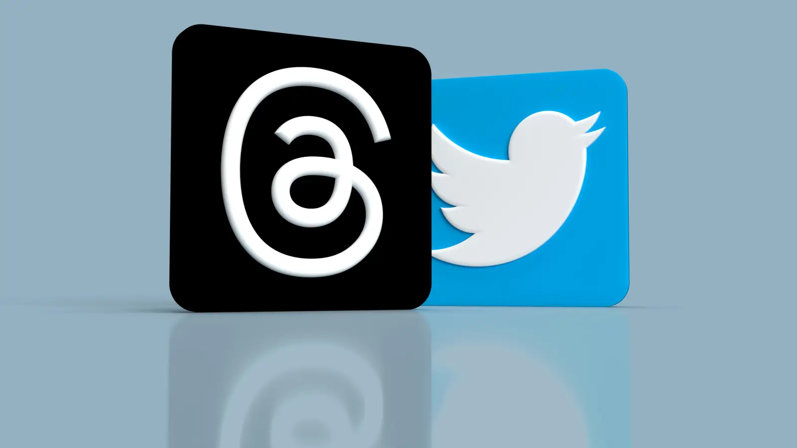 a black and a blue twitter logo